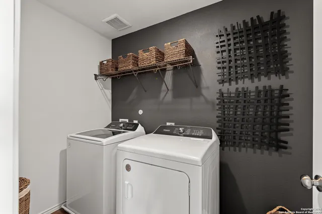 a utility room with dryer and washer
