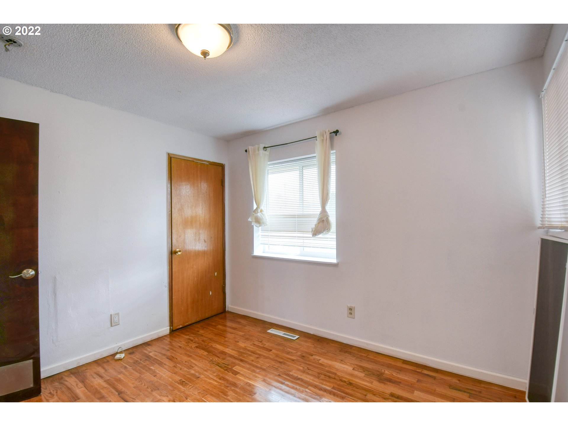 1410 Southwest 41st Street Pendleton, OR 97801 - Photo 14 of 32 a view of an empty room with a window