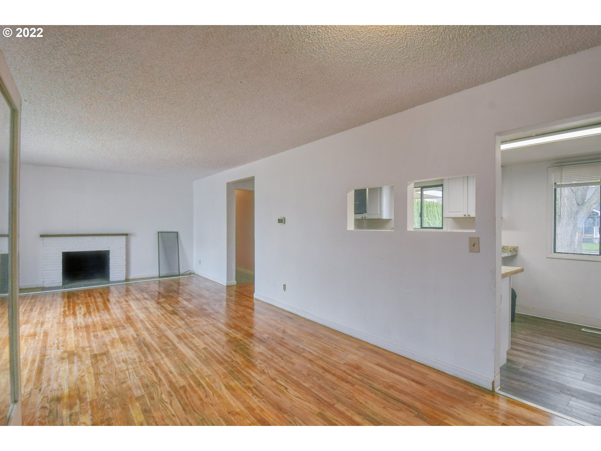 1410 Southwest 41st Street Pendleton, OR 97801 - Photo 4 of 32 a view of empty room with wooden floor and fireplace