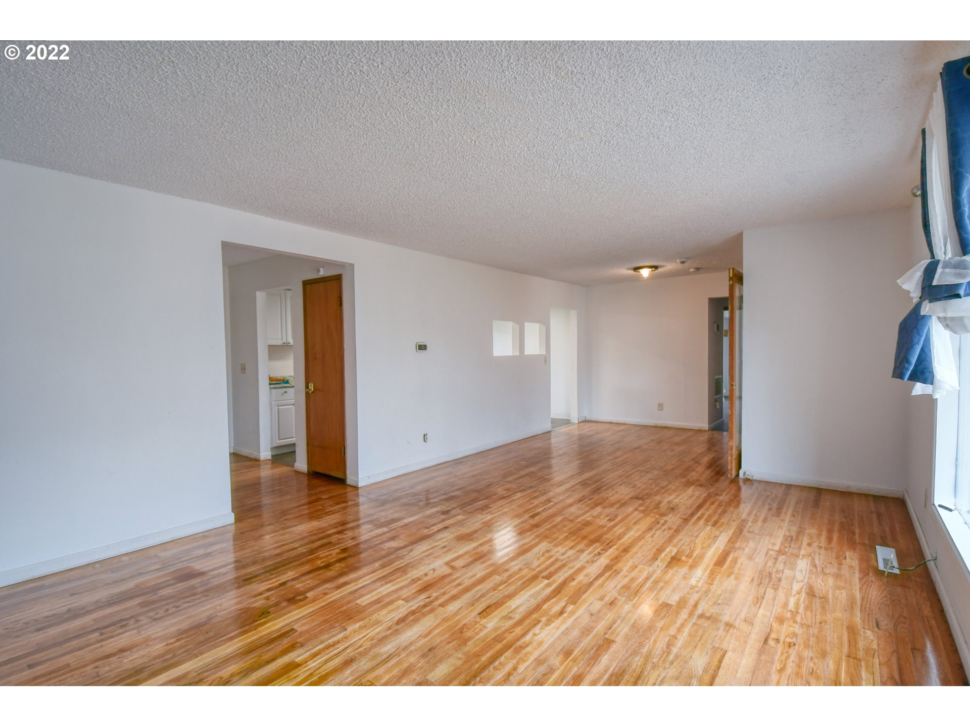 1410 Southwest 41st Street Pendleton, OR 97801 - Photo 7 of 32 a view of an empty room and wooden floor