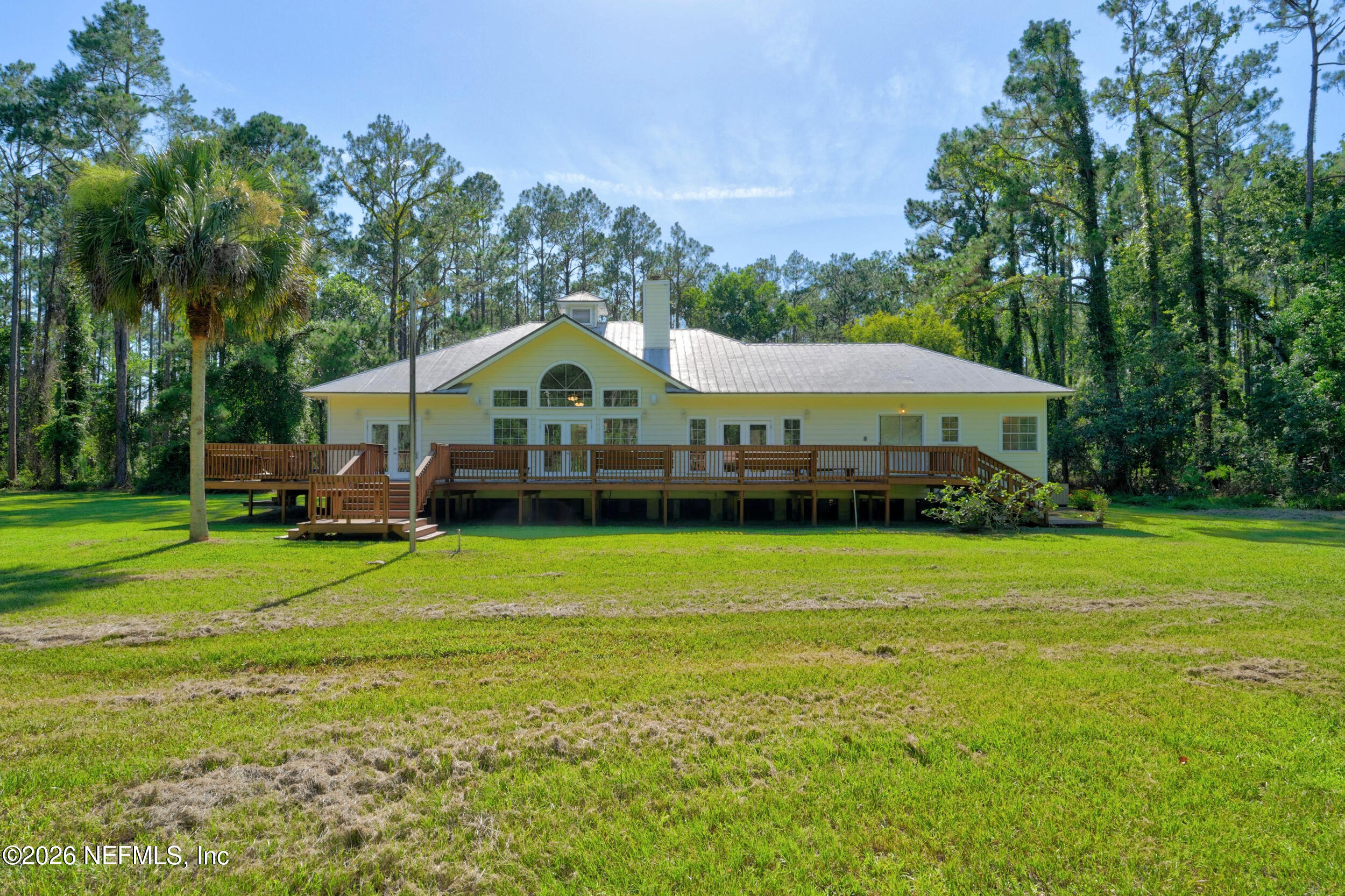 3090 Monument Bay Road St. Augustine, FL 32092 - Photo 46 of 56 a front view of a house with garden