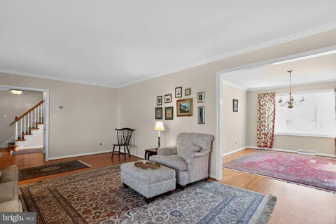 a living room with furniture and a rug