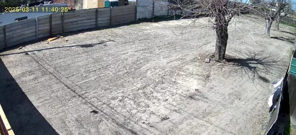 a view of a backyard of the house
