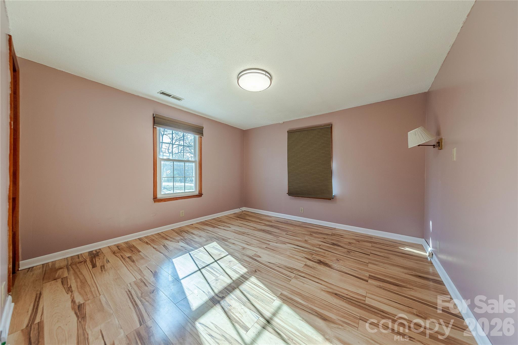 107 Valley Avenue Clover, SC 29710 - Photo 11 of 17 a view of empty room with wooden floor and fan