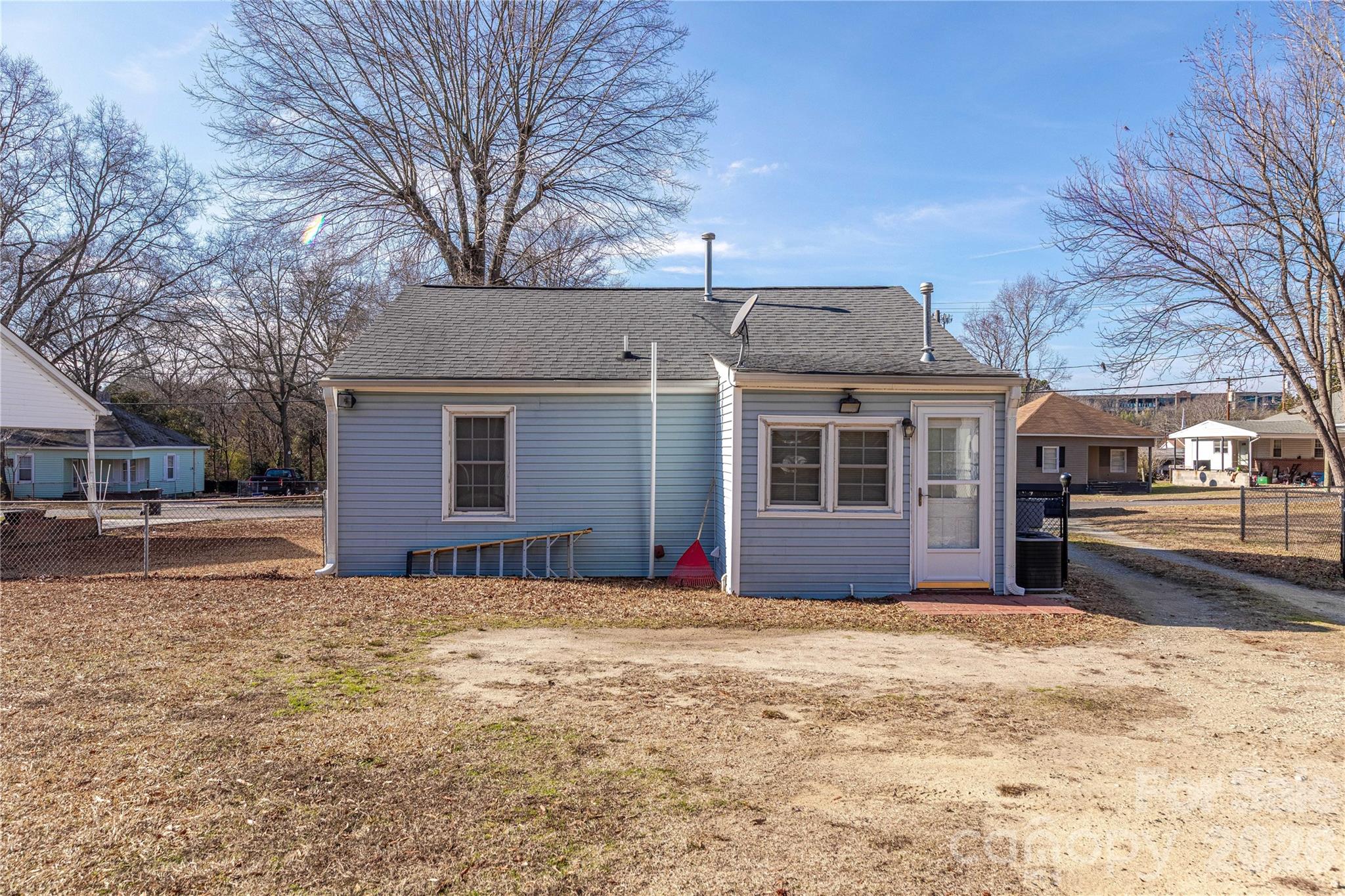 107 Valley Avenue Clover, SC 29710 - Photo 17 of 17 a front view of a house with a yard covered in snow