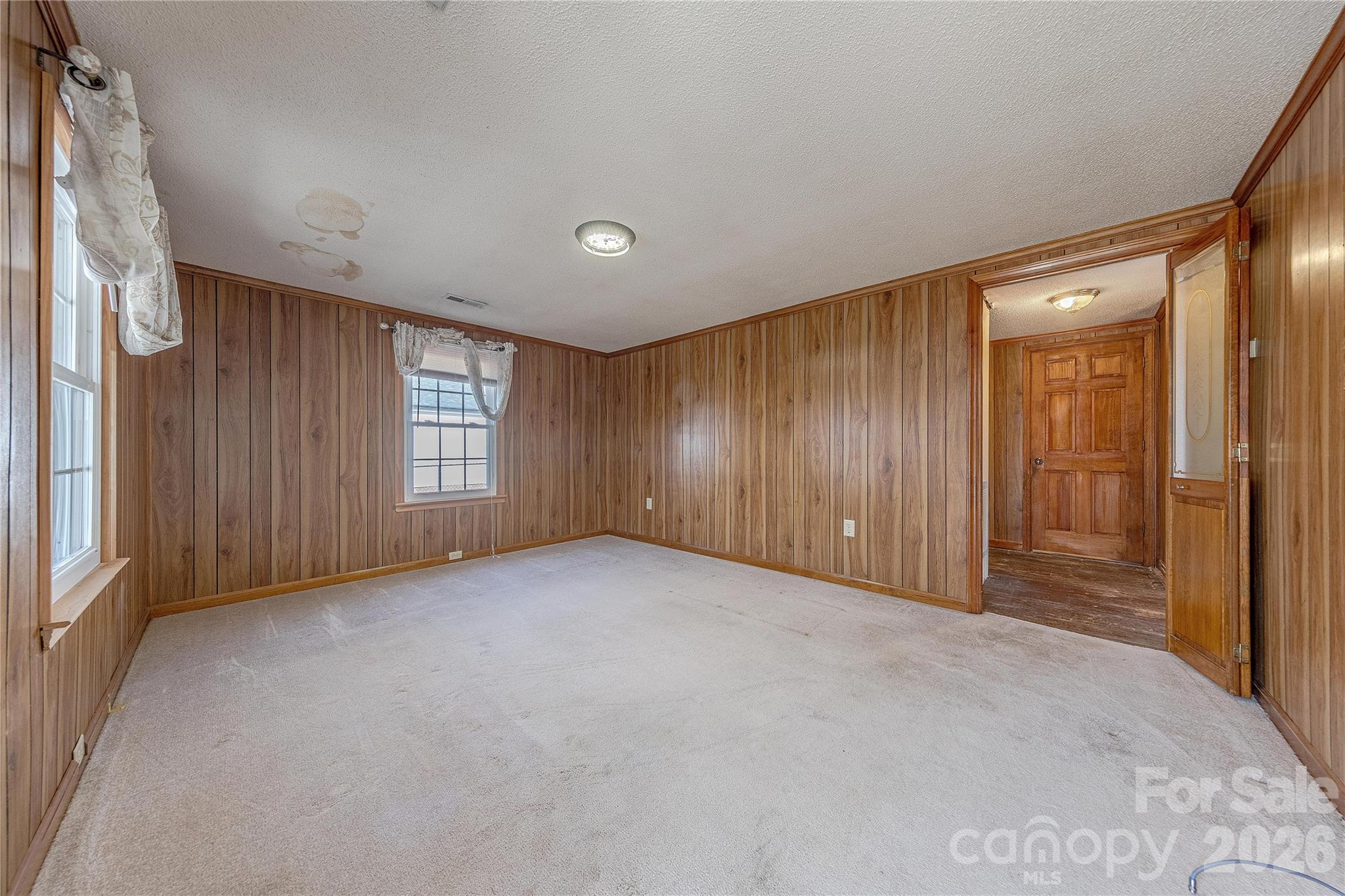 107 Valley Avenue Clover, SC 29710 - Photo 7 of 17 a view of an empty room with windows and closet