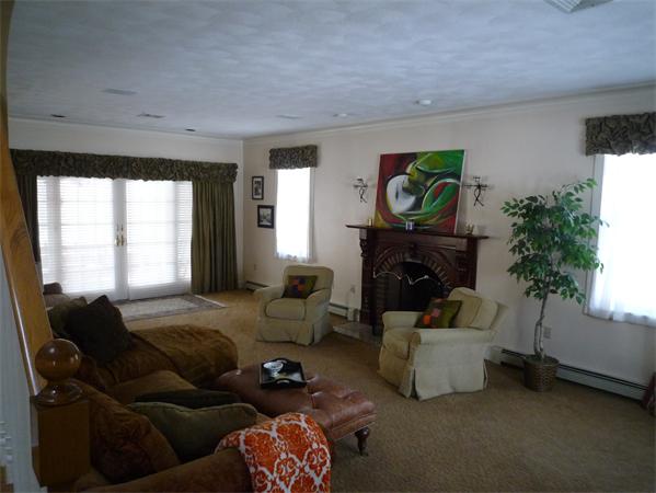 6 Stanley Road Middleton, MA 01949 - Photo 13 of 24 a living room with furniture and a fireplace