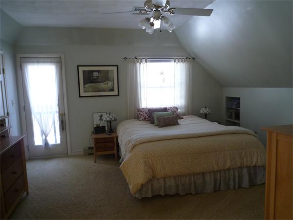 6 Stanley Road Middleton, MA 01949 - Photo 16 of 24 a bedroom with a bed and a window