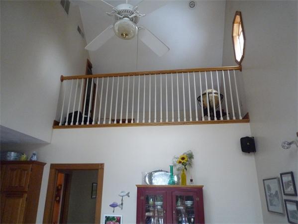 6 Stanley Road Middleton, MA 01949 - Photo 9 of 24 a view of hallway with a chair and frames on wall