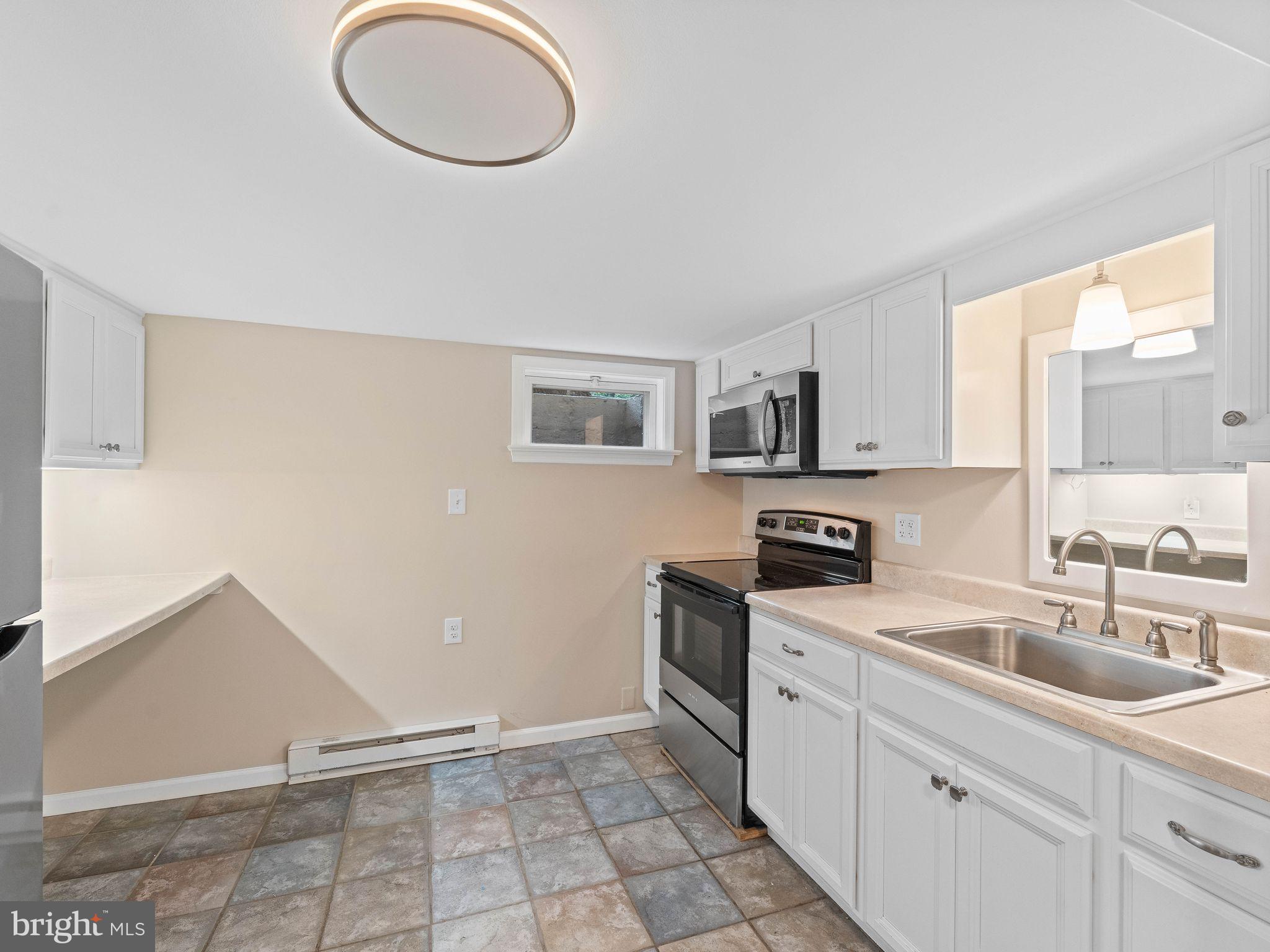 3395 Upper Valley Road Parkesburg, PA 19365 - Photo 28 of 56 Updated kitchen in Lower Level with breakfast bar