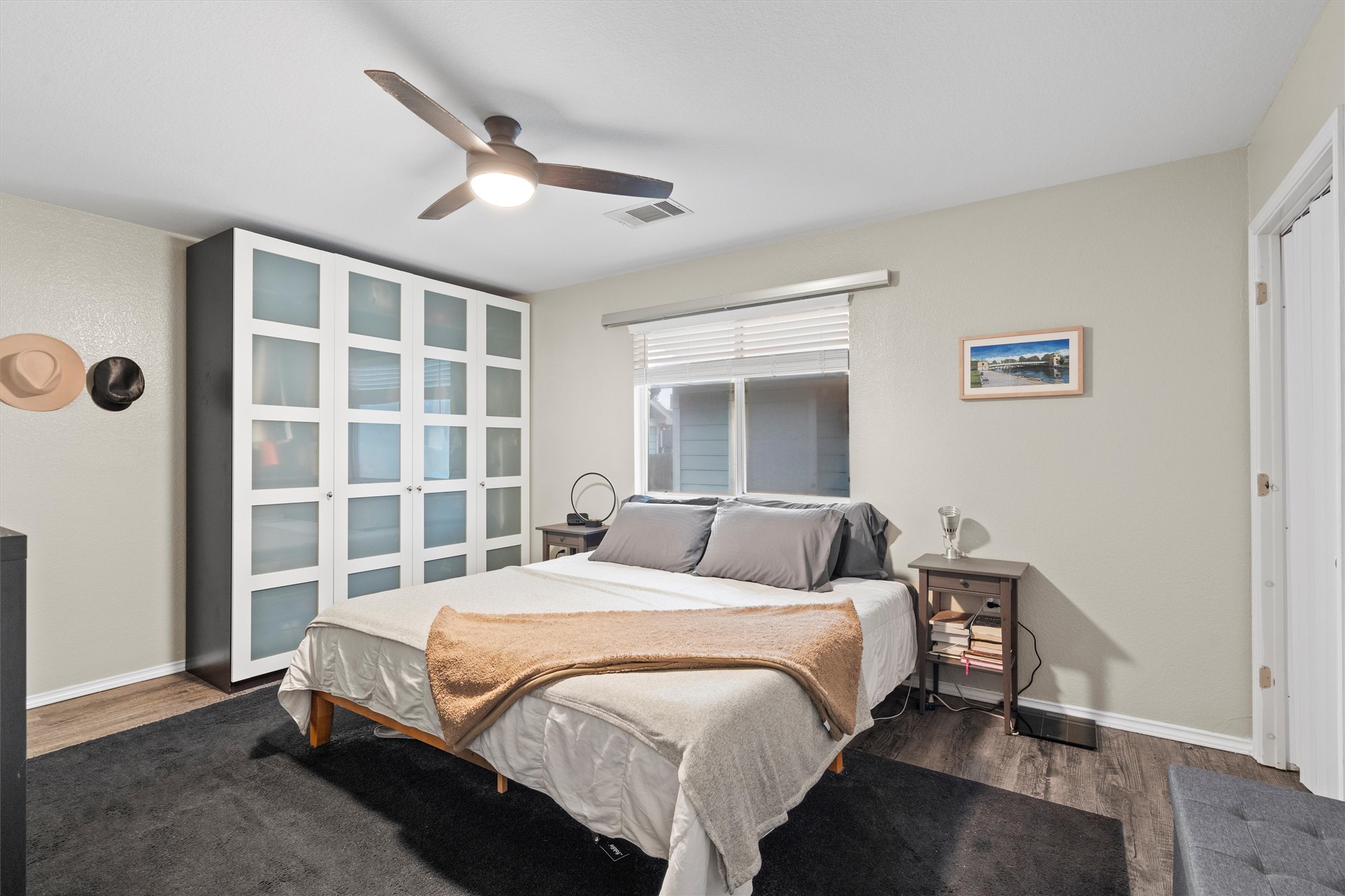 12117 Briarcreek Loop Manor, TX 78653 - Photo 12 of 29 Bedroom with dark wood-style floors and ceiling fan