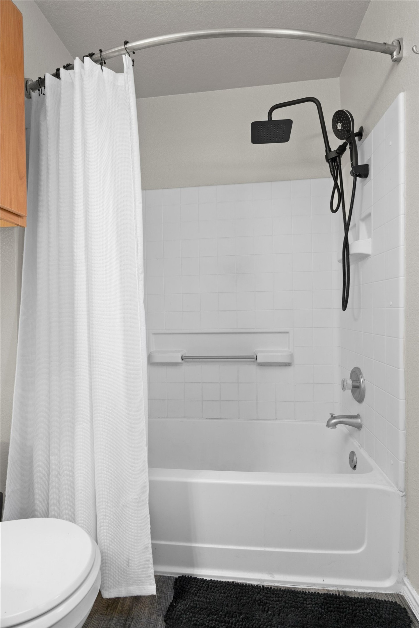 12117 Briarcreek Loop Manor, TX 78653 - Photo 15 of 29 Bathroom with shower / bath combo with shower curtain and toilet