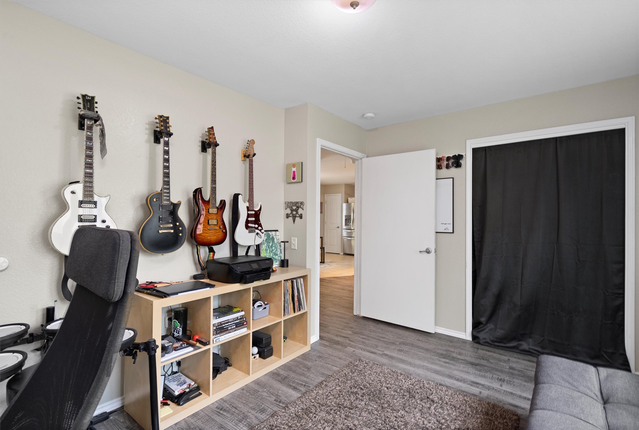 12117 Briarcreek Loop Manor, TX 78653 - Photo 17 of 29 Office area featuring wood finished floors and baseboards