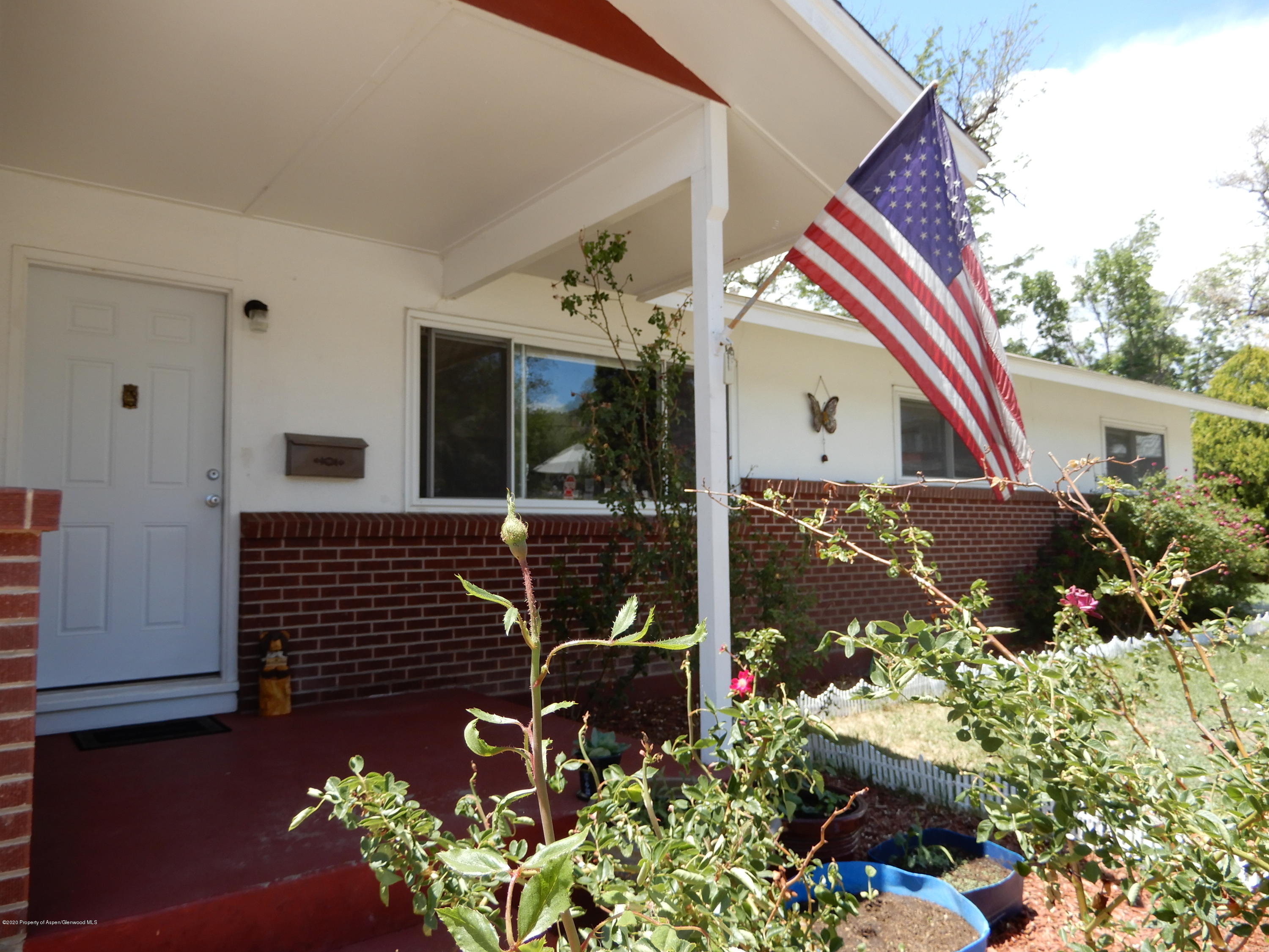 433 East Avenue Rifle, CO 81650 - Photo 2 of 39 a front view of a house with yard
