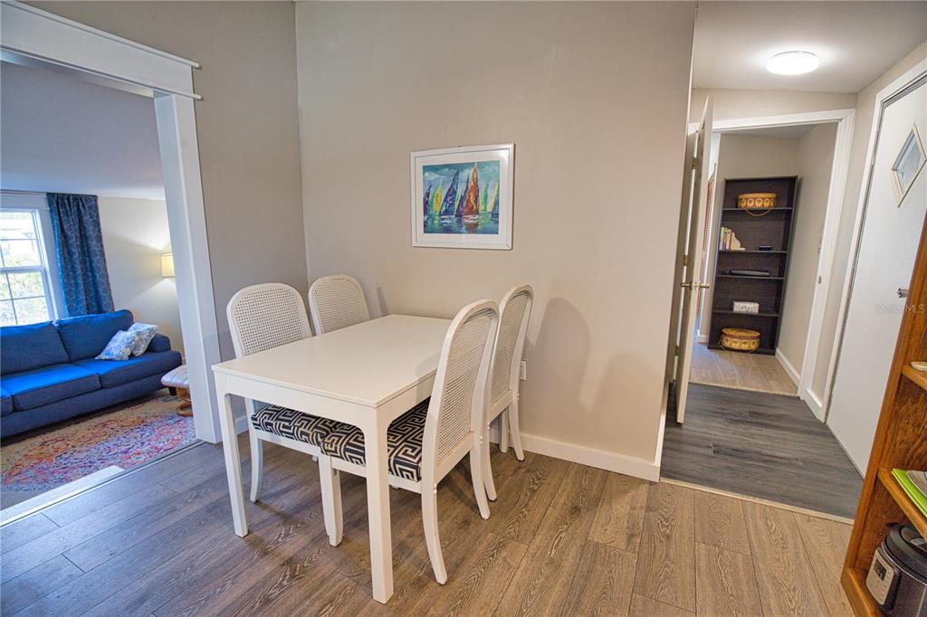 2302 Southeast Red Baron Drive Arcadia, FL 34266 - Photo 13 of 47 a view of a dining room with furniture and wooden floor
