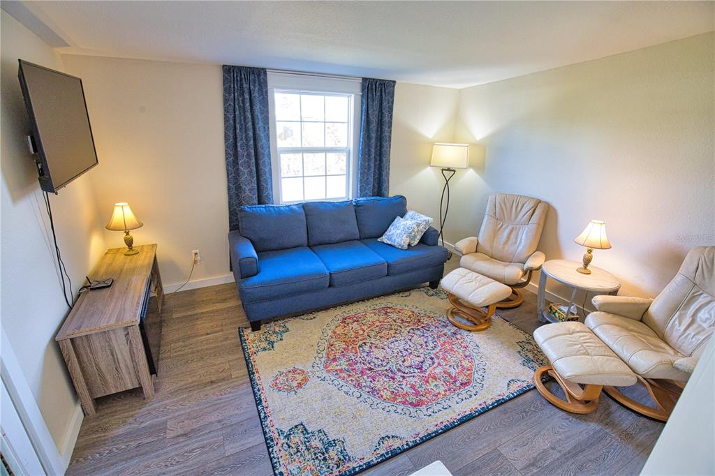 2302 Southeast Red Baron Drive Arcadia, FL 34266 - Photo 14 of 47 a living room with furniture and a window