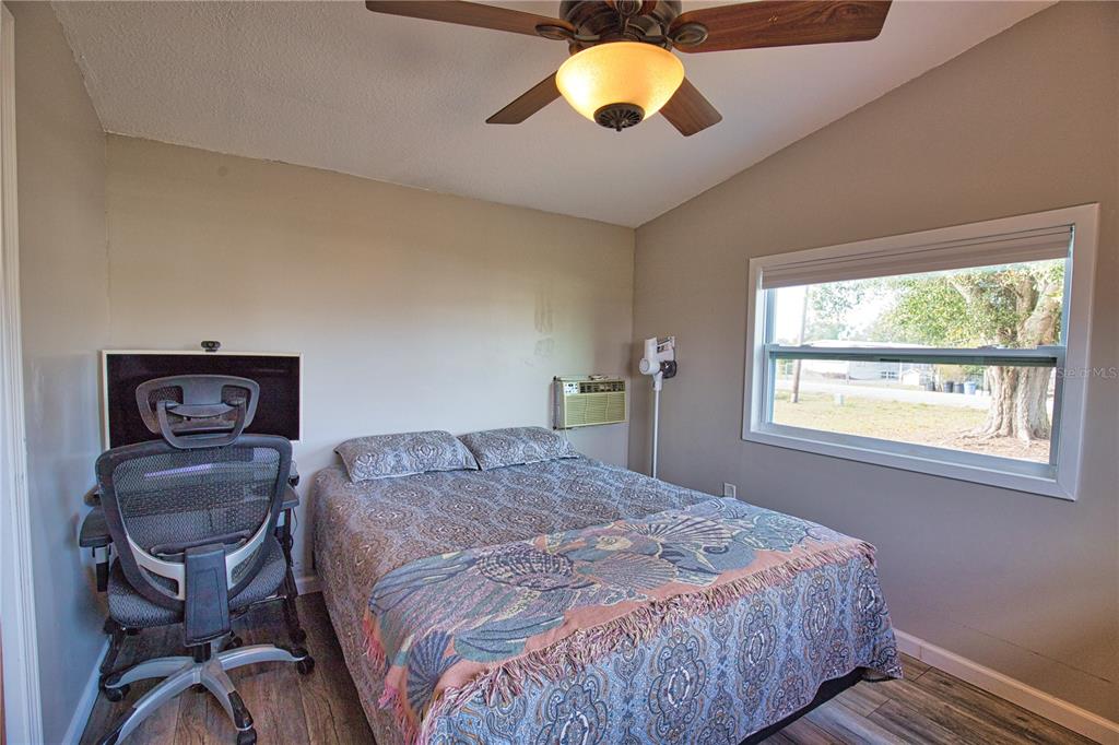 2302 Southeast Red Baron Drive Arcadia, FL 34266 - Photo 19 of 47 a bedroom with a bed and window