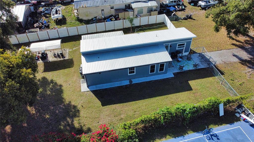 2302 Southeast Red Baron Drive Arcadia, FL 34266 - Photo 46 of 47 a view of a balcony with couches and wooden floor