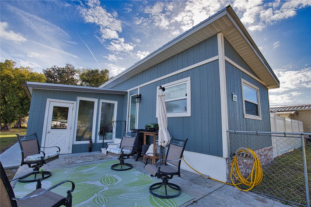 2302 Southeast Red Baron Drive Arcadia, FL 34266 - Photo 5 of 47 a view of patio with couple of chairs and a table