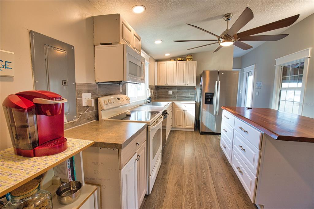 2302 Southeast Red Baron Drive Arcadia, FL 34266 - Photo 10 of 47 a kitchen with stainless steel appliances granite countertop a sink stove and refrigerator