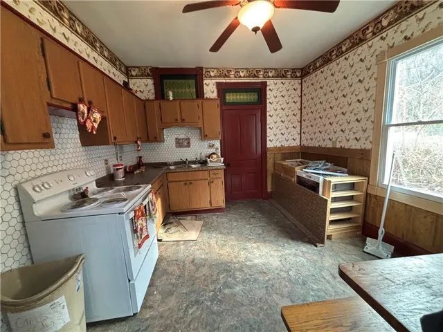 a kitchen with a stove and a microwave