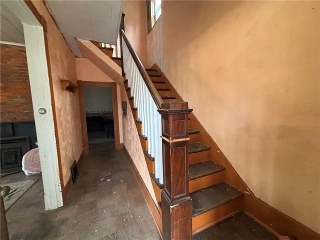 a view of a hallway with staircase