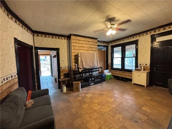 a living room with furniture and a large window