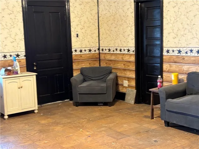 a living room with furniture and a window