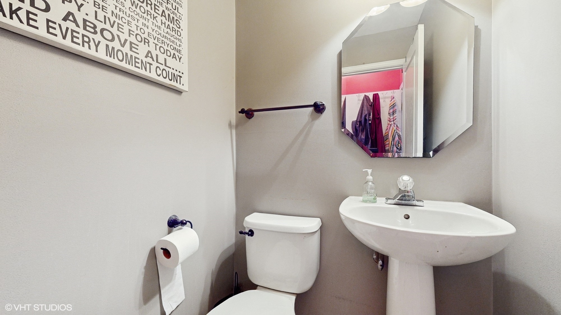 1501 Spaulding Road Bartlett, IL 60103 - Photo 11 of 28 a bathroom with a sink and mirror with toilet