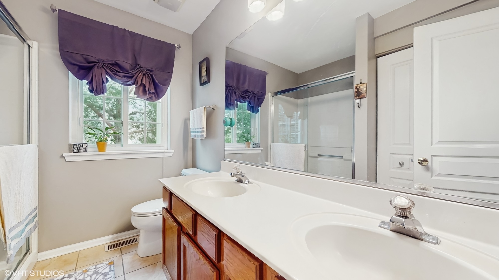 1501 Spaulding Road Bartlett, IL 60103 - Photo 15 of 28 a bathroom with a sink and a mirror