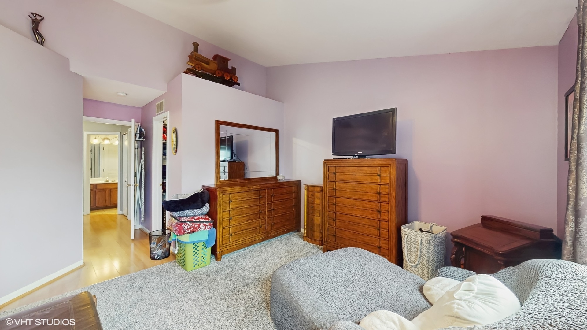 1501 Spaulding Road Bartlett, IL 60103 - Photo 18 of 28 a bedroom with furniture and a flat screen tv