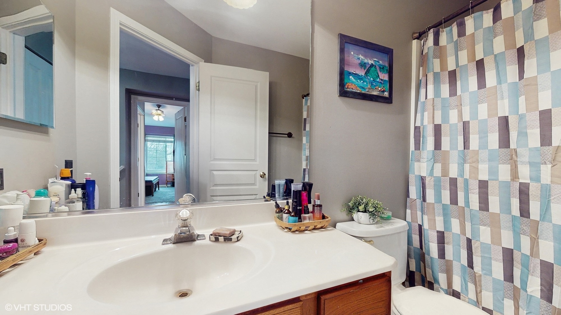1501 Spaulding Road Bartlett, IL 60103 - Photo 19 of 28 a bathroom with a sink and a mirror