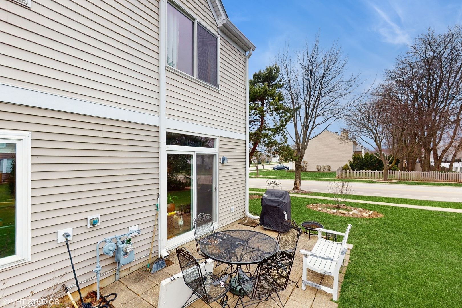 1501 Spaulding Road Bartlett, IL 60103 - Photo 23 of 28 a view of a white house with a yard and sitting area