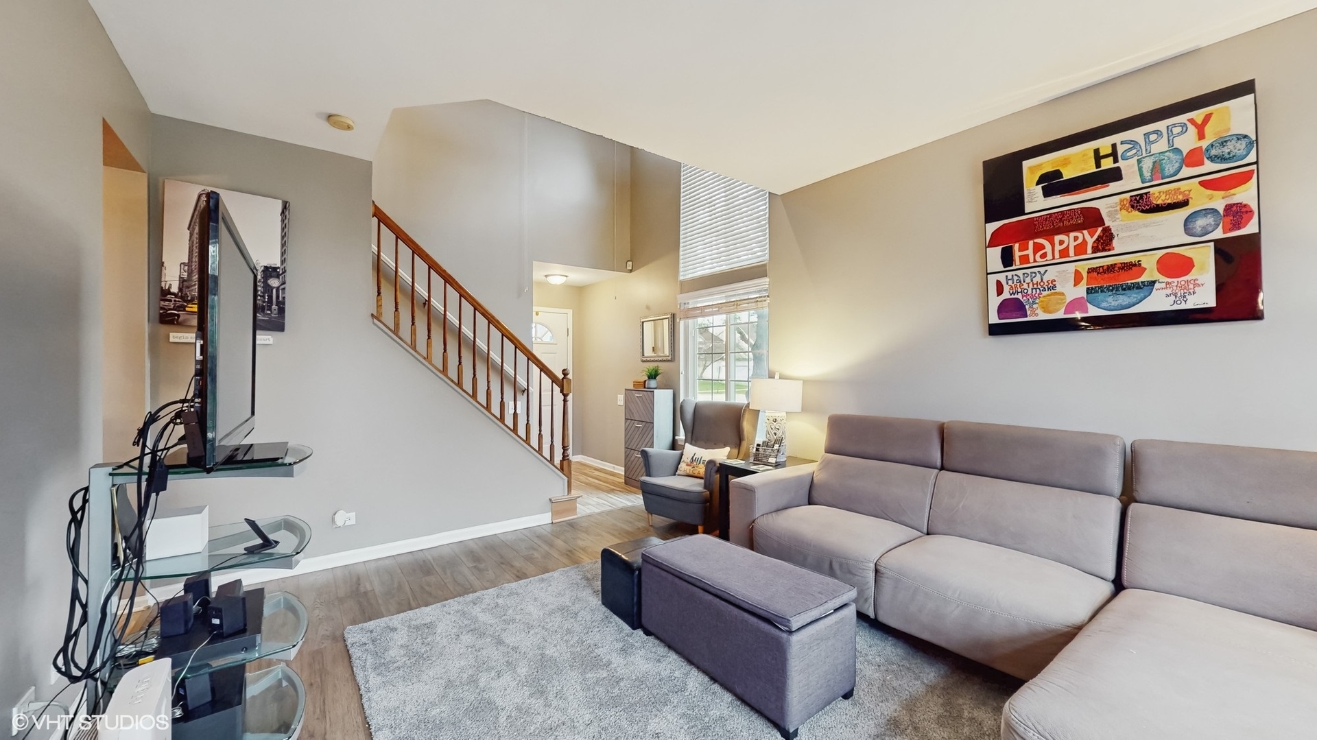 1501 Spaulding Road Bartlett, IL 60103 - Photo 4 of 28 a living room with furniture and a painting on the wall