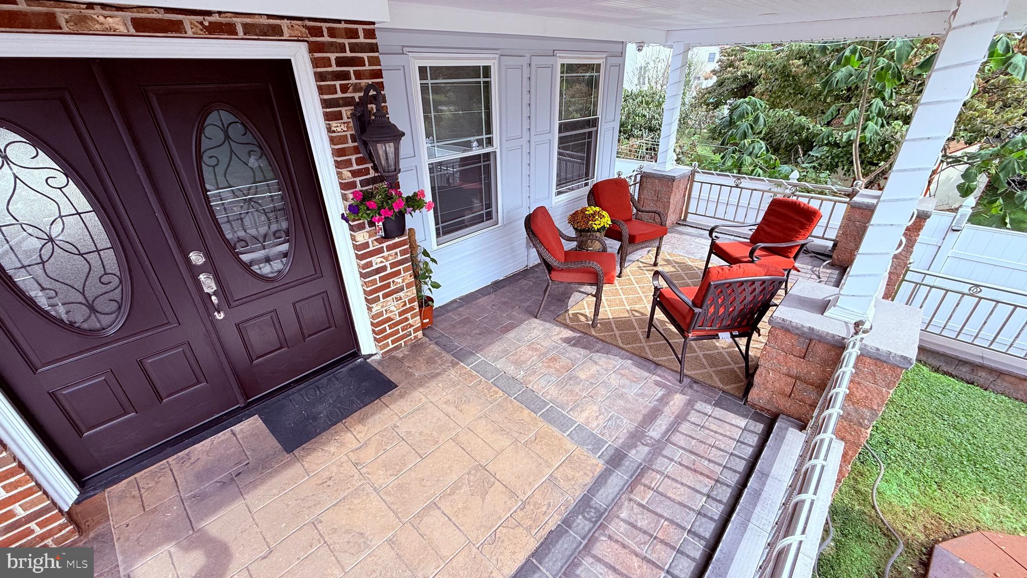 8905 Springview Road Philadelphia, PA 19115 - Photo 11 of 113 a patio with lawn chairs and wooden floor