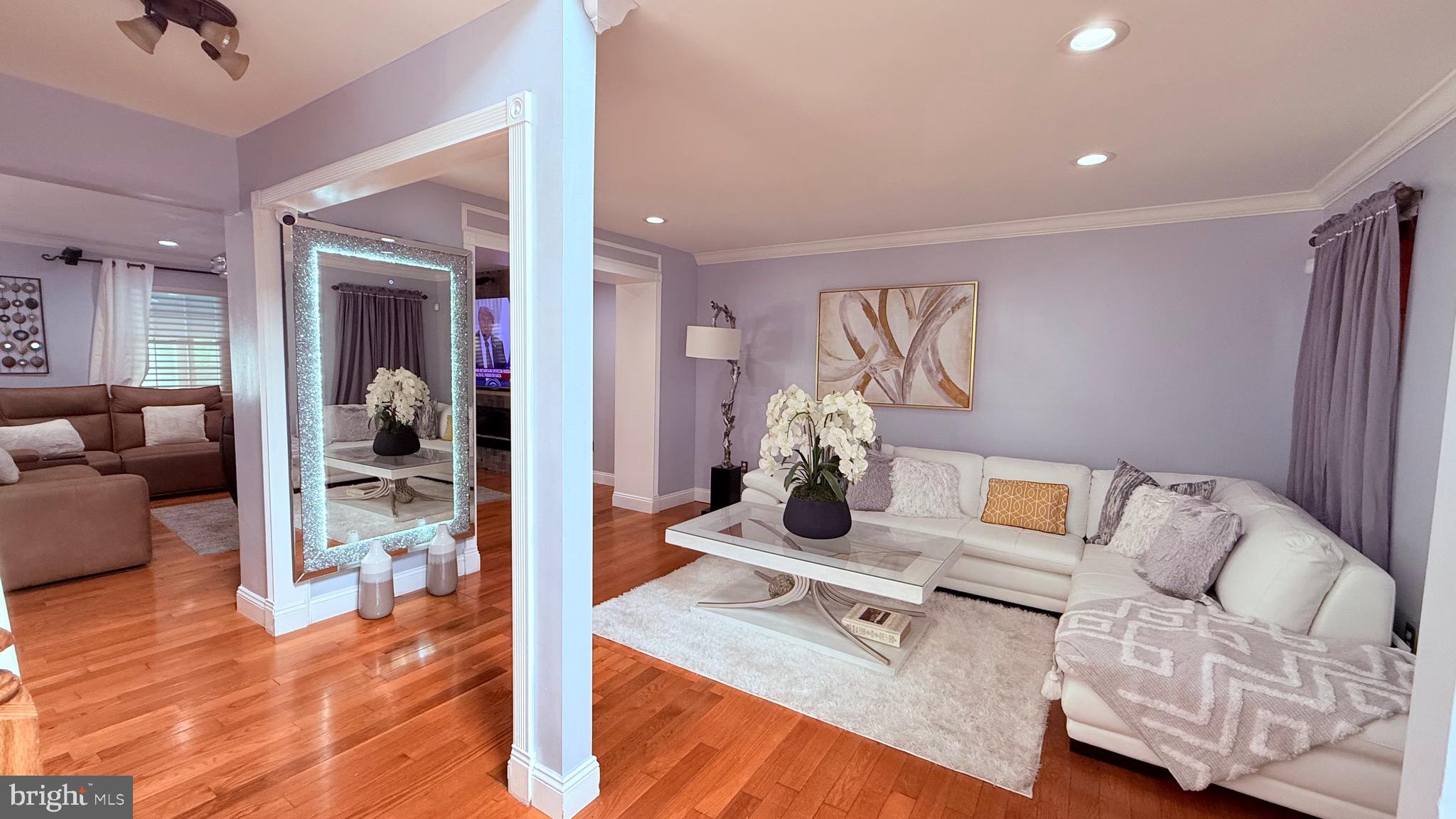 8905 Springview Road Philadelphia, PA 19115 - Photo 16 of 113 a living room with furniture and wooden floor