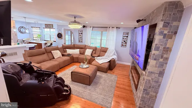 a kitchen with stainless steel appliances granite countertop a sink and a stove