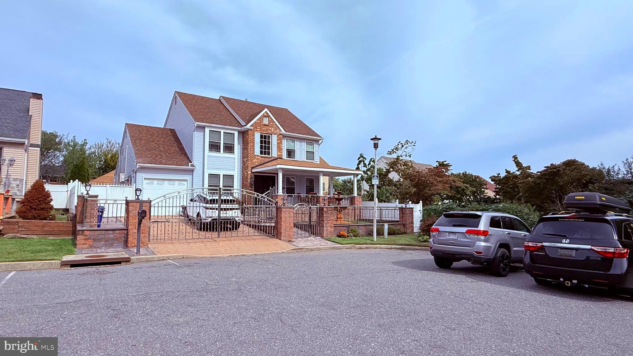 8905 Springview Road Philadelphia, PA 19115 - Photo 2 of 113 a view of a car parked in front of a house