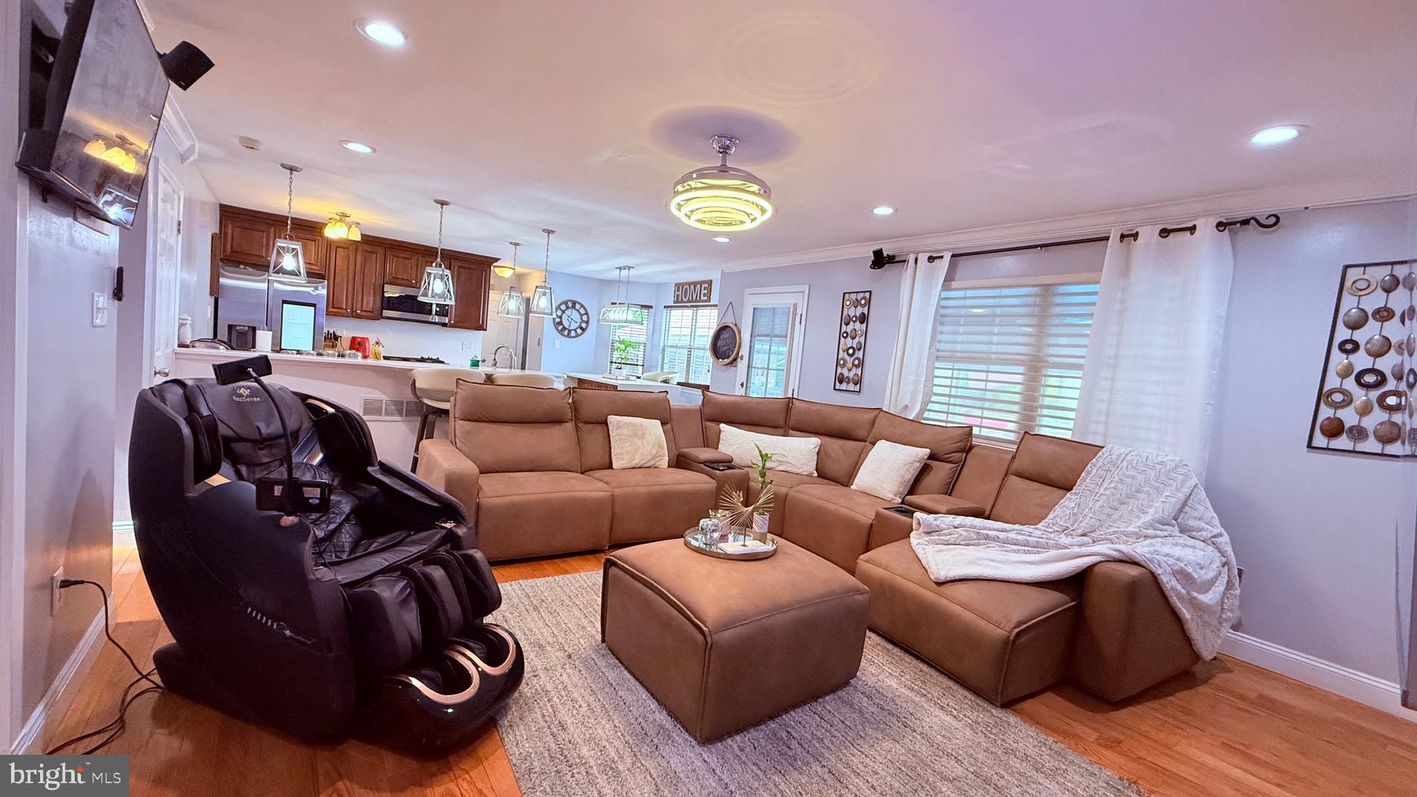 8905 Springview Road Philadelphia, PA 19115 - Photo 21 of 113 a living room with furniture and a clock