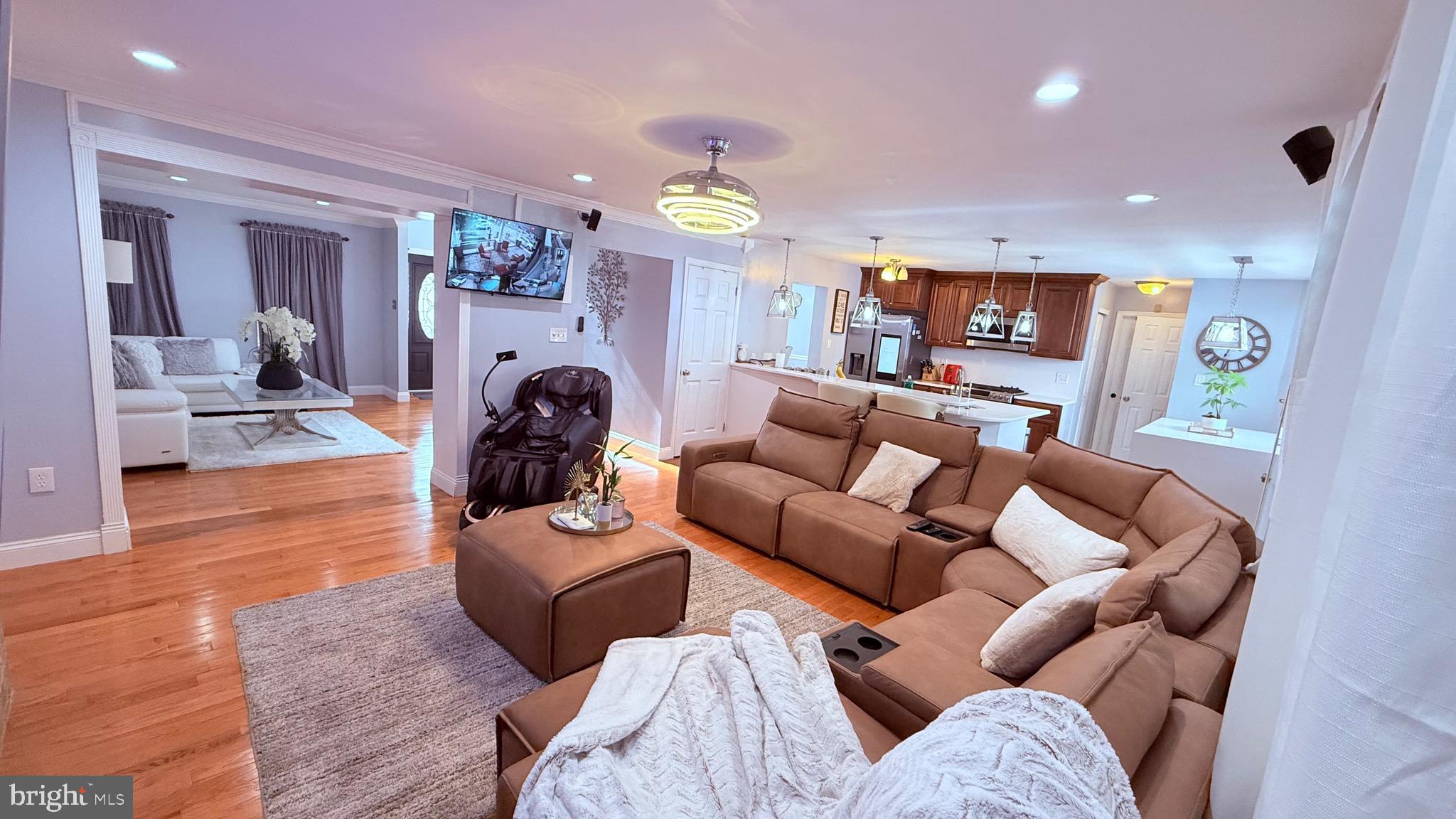 8905 Springview Road Philadelphia, PA 19115 - Photo 22 of 113 a living room with furniture and a fireplace
