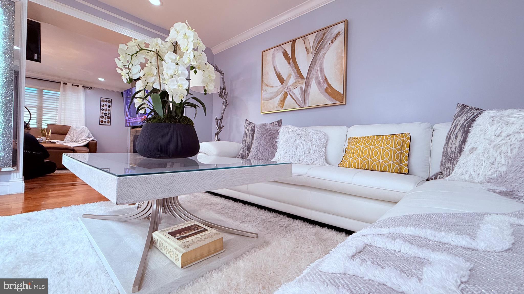 8905 Springview Road Philadelphia, PA 19115 - Photo 25 of 113 a living room with furniture flowerpot and wooden floor