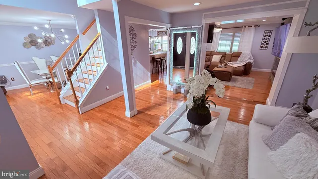 a living room with furniture and floor to ceiling windows