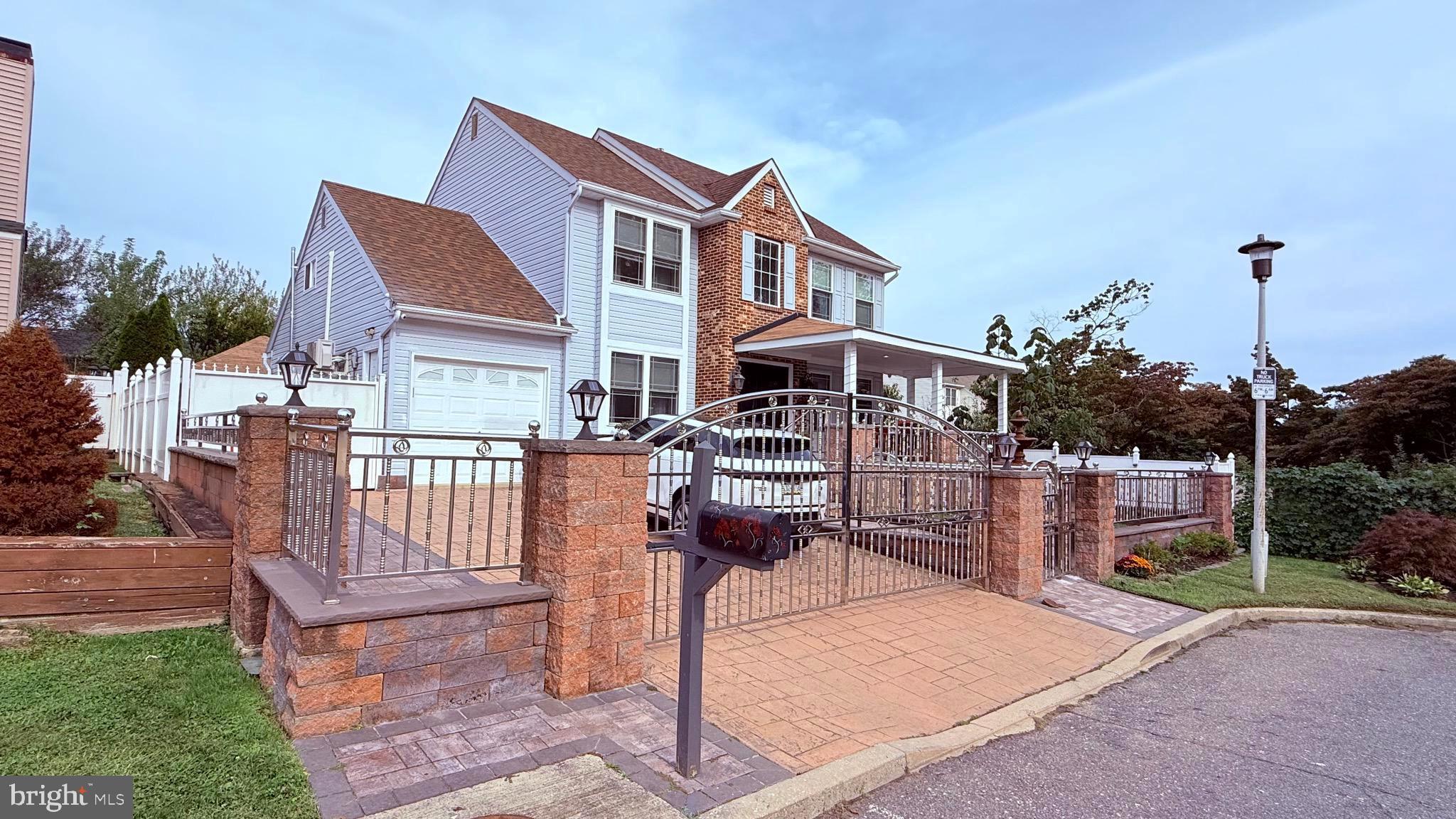 8905 Springview Road Philadelphia, PA 19115 - Photo 3 of 113 a front view of a house with a porch