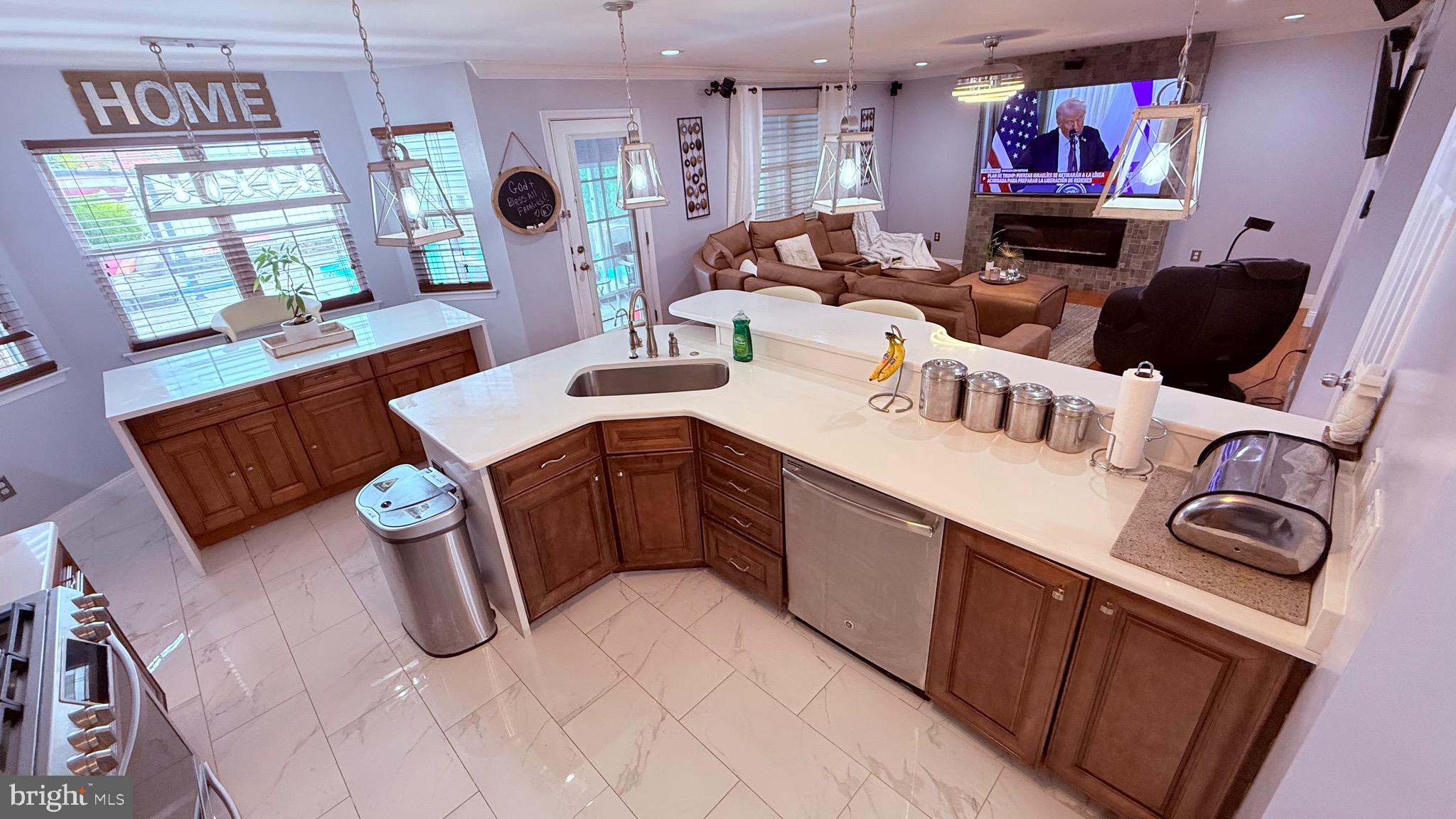 8905 Springview Road Philadelphia, PA 19115 - Photo 33 of 113 a kitchen with stainless steel appliances granite countertop a sink and a stove