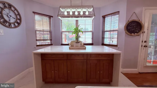 a view of hallway with stairs and wooden floor