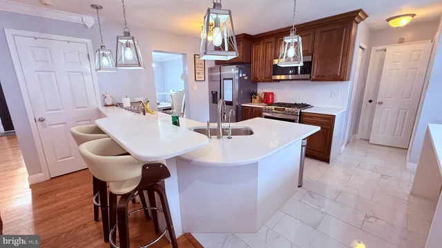 a view of staircase with railing and white walls