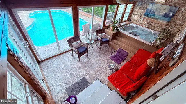 a bedroom with furniture and a flat screen tv