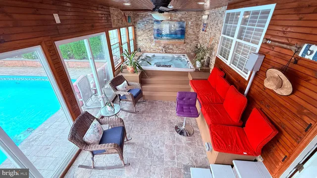 a bathroom with a sink a large mirror and a bathtub