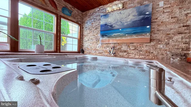 a bath room with a toilet and a tub