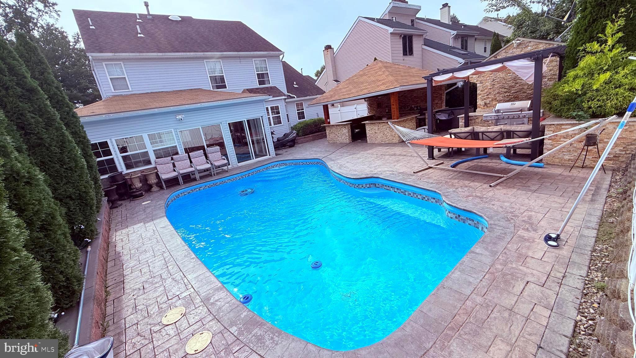 8905 Springview Road Philadelphia, PA 19115 - Photo 65 of 113 an aerial view of a house with swimming pool